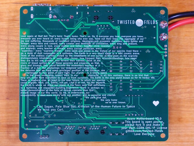The back of our motherboard PCB, featuring our logo, an invitation to fork the design, and the full text of the famous "Pale Blue Dot" speech by Carl Sagan.